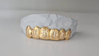 Gold Grillz with Diamond-Cut Engraving